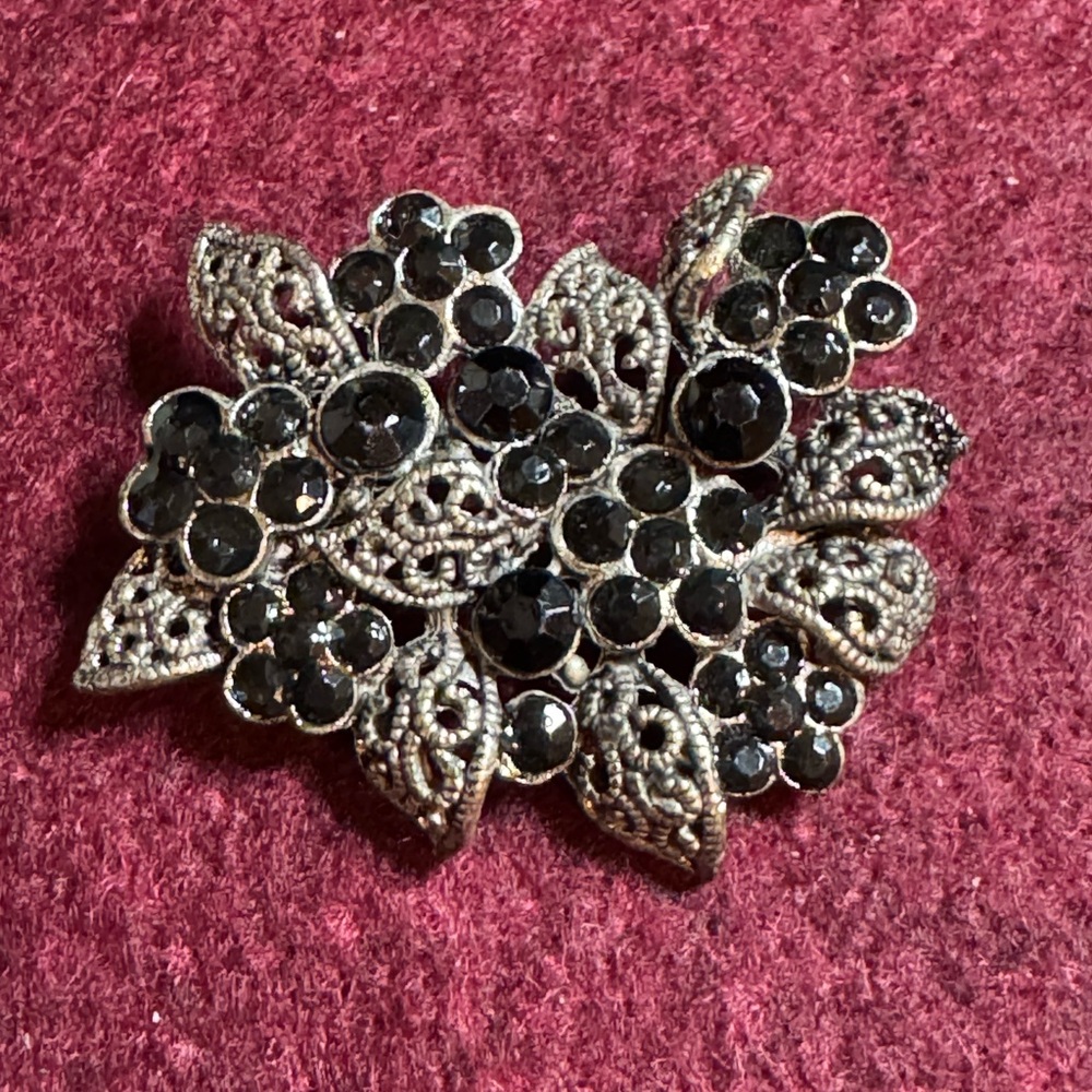 Vintage black rhinestone filigree floral leaf brooch